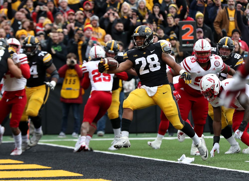 Iowa Hawkeyes running back Toren Young (28) scores against the Nebraska Cornhuskers Friday, November 23, 2018 at Kinnick Stadium. (Brian Ray/hawkeyesports.com)