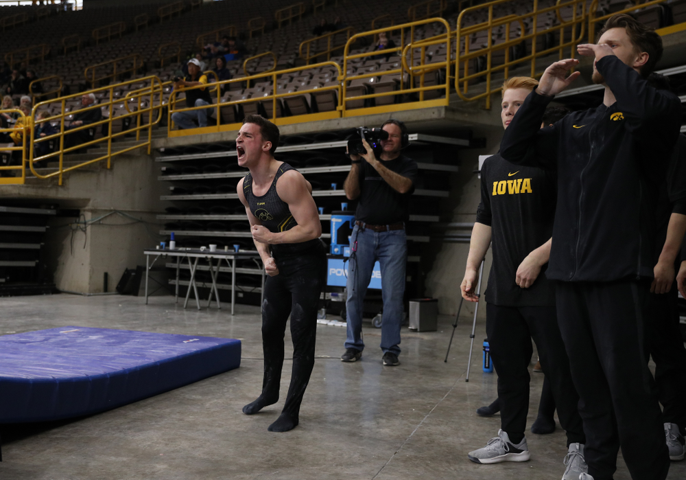 Iowa's Jake Brodarzon cheers on his teammates during their meet against the Ohio State Buckeyes Saturday, March 16, 2019 at Carver-Hawkeye Arena. (Brian Ray/hawkeyesports.com)