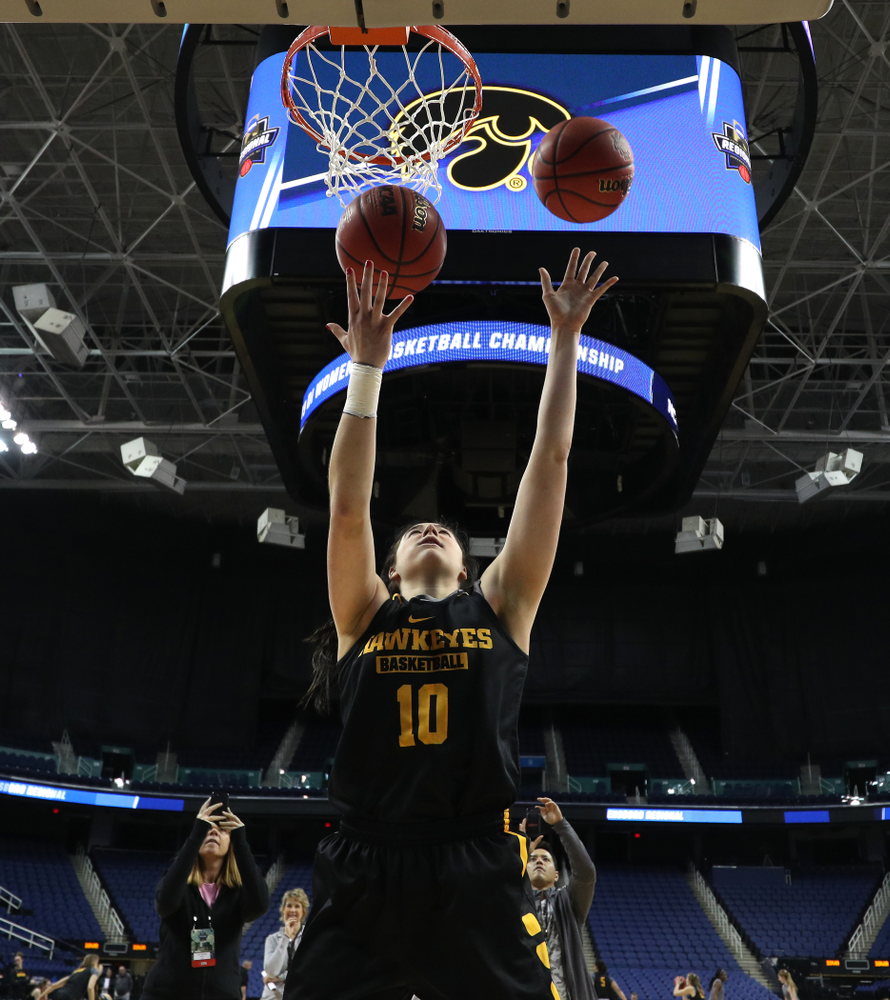 Iowa Hawkeyes forward Megan Gustafson (10) does the Mikan Drill the ESPN Crew following practice for their Sweet 16 matchup against NC State Friday, March 29, 2019 at the Greensboro Coliseum in Greensboro, NC.(Brian Ray/hawkeyesports.com)
