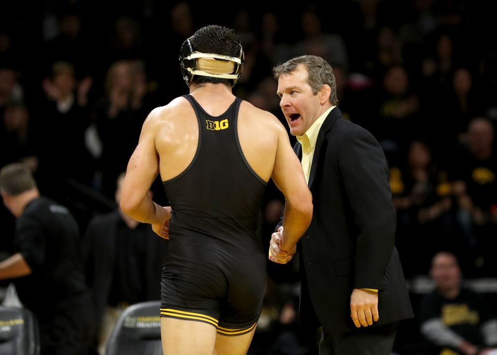 Head Coach Tom Brands congratulates Iowa’s Michael Kemerer after his match with Ohio State’s Kaleb Romero at 174 pounds Friday, January 24, 2020 at Carver-Hawkeye Arena. Kemerer won the match 7-1. (Brian Ray/hawkeyesports.com)