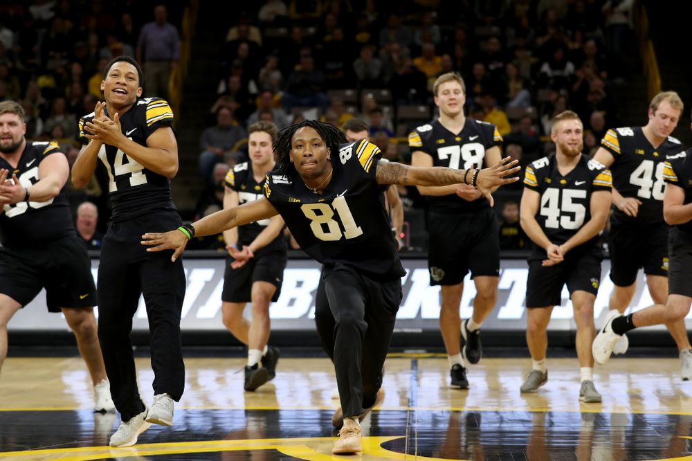 Members of the Hawkeye Football team performs with the Iowa Dance Team at halftime of the Iowa Hawkeyes game against the Ohio State Buckeyes Thursday, February 20, 2020 at Carver-Hawkeye Arena. (Brian Ray/hawkeyesports.com)