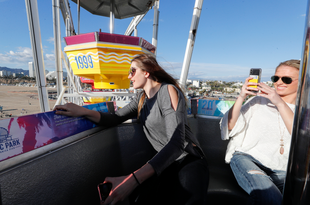 Iowa Hawkeyes forward Megan Gustafson (10) and guard Makenzie Meyer (3) ride the ferris wheel in Pacific Park on the Santa Monica Pier Thursday, March 15, 2018 in Santa Monica. (Brian Ray/hawkeyesports.com)