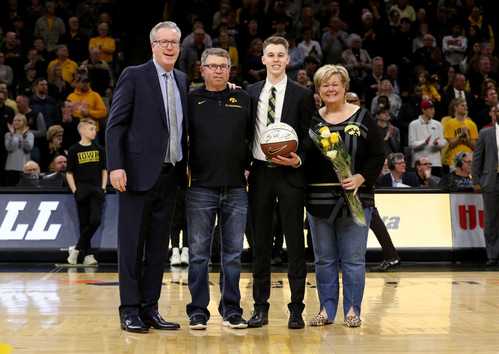 Senior Student Manager Jarrett Knepper and his family during senior night festivities before their game against the Purdue Boilermakers Tuesday, March 3, 2020 at Carver-Hawkeye Arena. (Brian Ray/hawkeyesports.com)