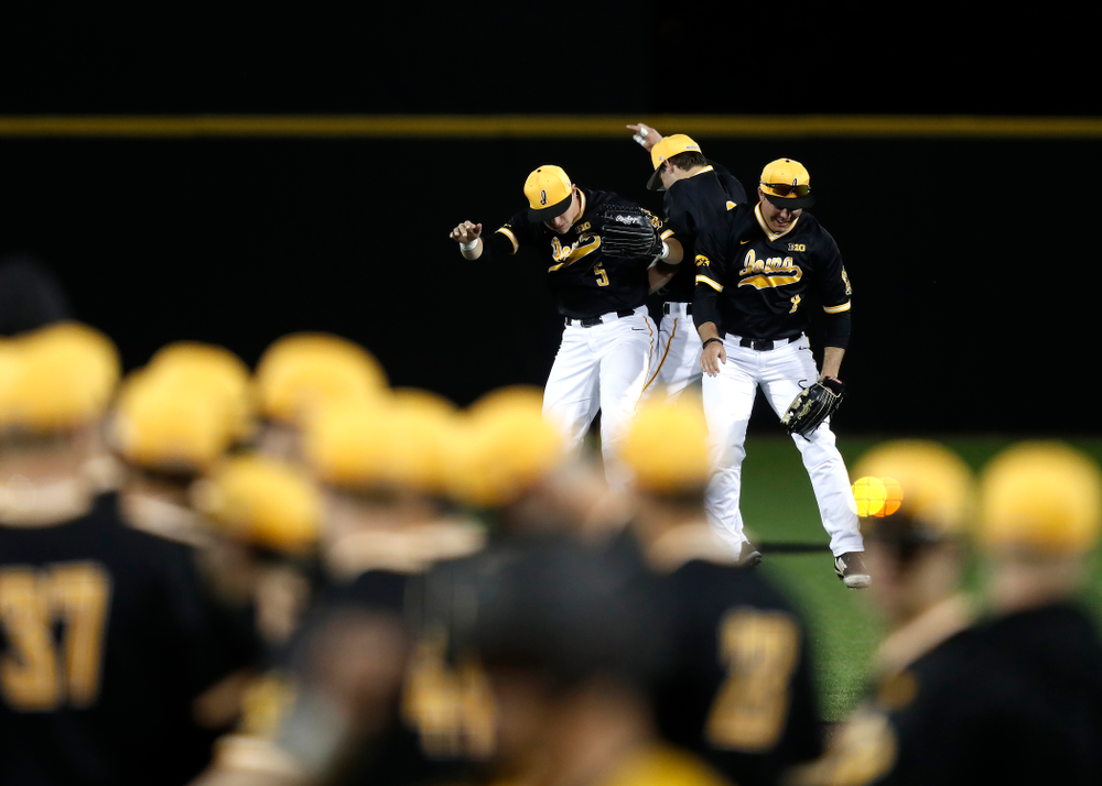 Iowa Hawkeyes catcher Tyler Cropley (5), outfielder Ben Norman (9), and outfielder Luke Farley (8) against Milwaukee Wednesday, April 25, 2018 at Duane Banks Field. (Brian Ray/hawkeyesports.com)