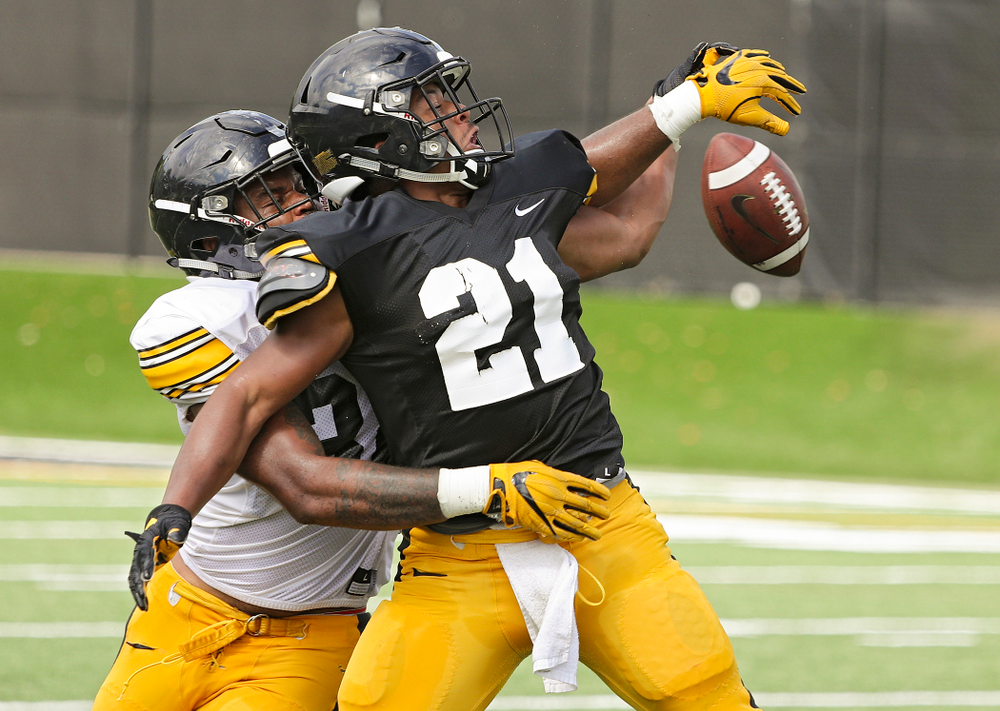 Iowa Hawkeyes linebacker Djimon Colbert (32) breaks up a pass intended for running back Ivory Kelly-Martin (21) during Fall Camp Practice No. 11 at the Hansen Football Performance Center in Iowa City on Wednesday, Aug 14, 2019. (Stephen Mally/hawkeyesports.com)