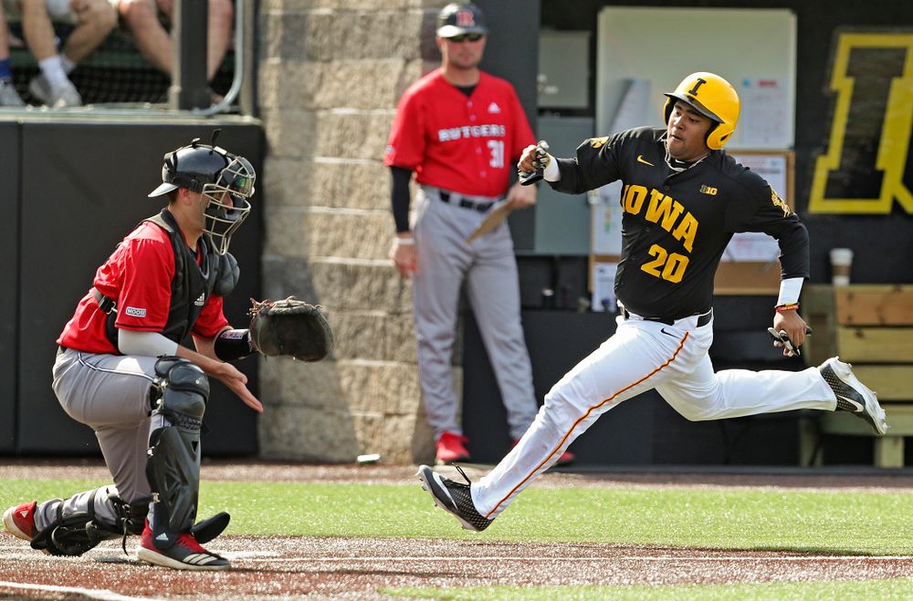 Iowa Hawkeyes designated hitter Izaya Fullard (20) scores a run during the sixth inning of their game against Rutgers at Duane Banks Field in Iowa City on Saturday, Apr. 6, 2019. (Stephen Mally/hawkeyesports.com)
