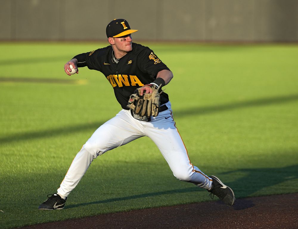 Iowa infielder Brendan Sher (2) throws to first during the fourth inning of their game at Duane Banks Field in Iowa City on Tuesday, March 3, 2020. (Stephen Mally/hawkeyesports.com)