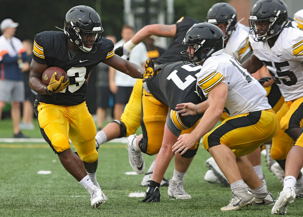 Iowa Hawkeyes running back Shadrick Byrd (23) eyes linebacker Mike Timm (19) durning Fall Camp Practice No. 17 at the Hansen Football Performance Center in Iowa City on Wednesday, Aug 21, 2019. (Stephen Mally/hawkeyesports.com)