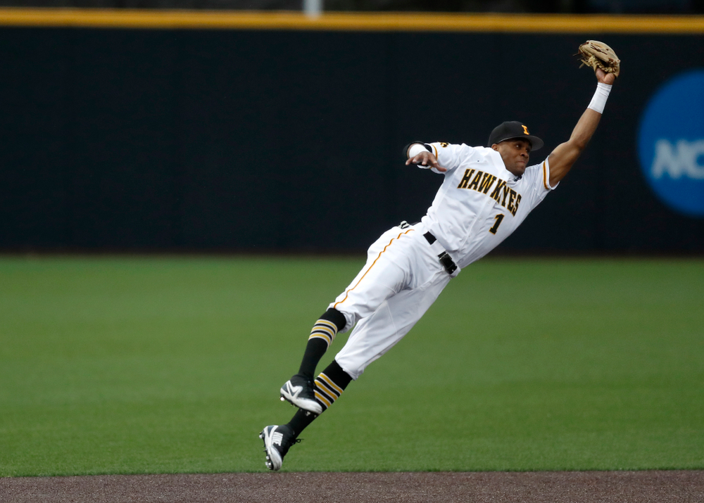 Iowa Hawkeyes third baseman Lorenzo Elion (1) makes a leaping catch on a line drive against Coe College Wednesday, April 11, 2018 at Duane Banks Field. (Brian Ray/hawkeyesports.com)