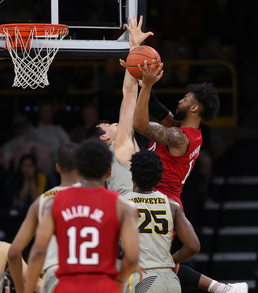 Iowa Hawkeyes forward Ryan Kriener (15) blocks a shot against the Nebraska Cornhuskers Sunday, January 6, 2019 at Carver-Hawkeye Arena. (Brian Ray/hawkeyesports.com)