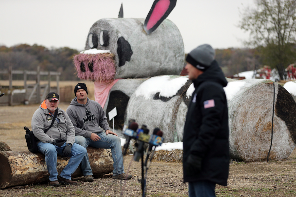 Former Hawkeye Football player and ANF honoree Matt Kroul listens as Iowa Wrestling Head Coach Tom Brands answers questions from reporters during the teamÕs annual media day Wednesday, October 30, 2019 at Kroul Family Farms in Mount Vernon. (Brian Ray/hawkeyesports.com)
