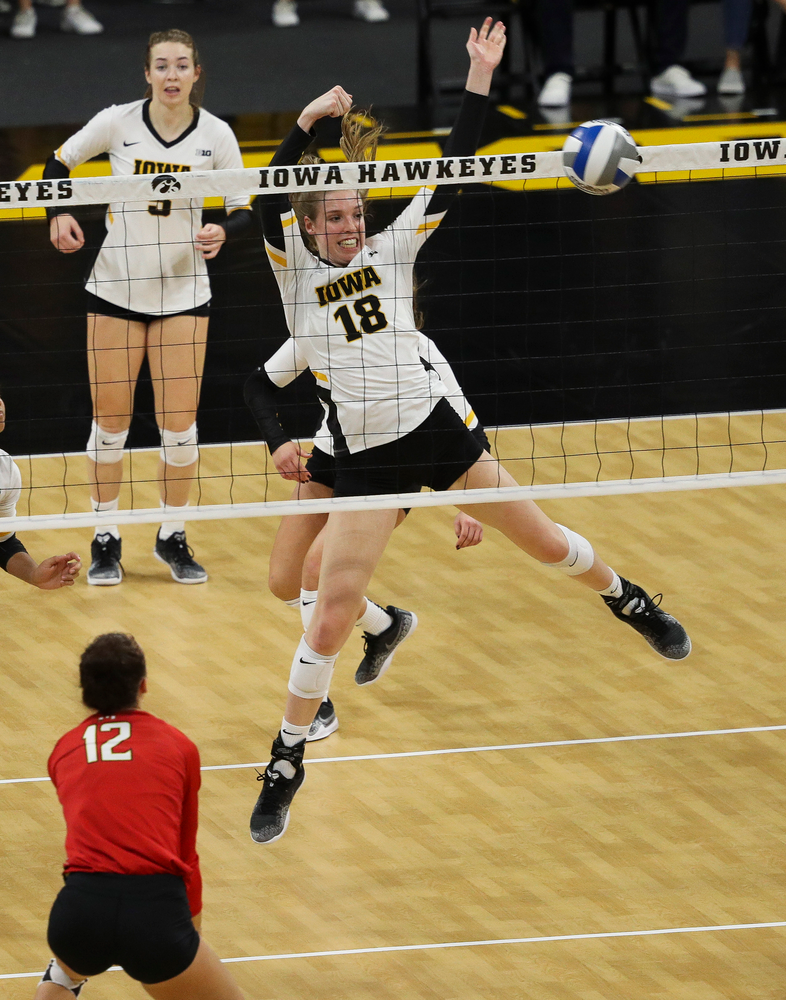 Iowa Hawkeyes middle blocker Hannah Clayton (18) goes up for a block during a match against Maryland at Carver-Hawkeye Arena on November 23, 2018. (Tork Mason/hawkeyesports.com)