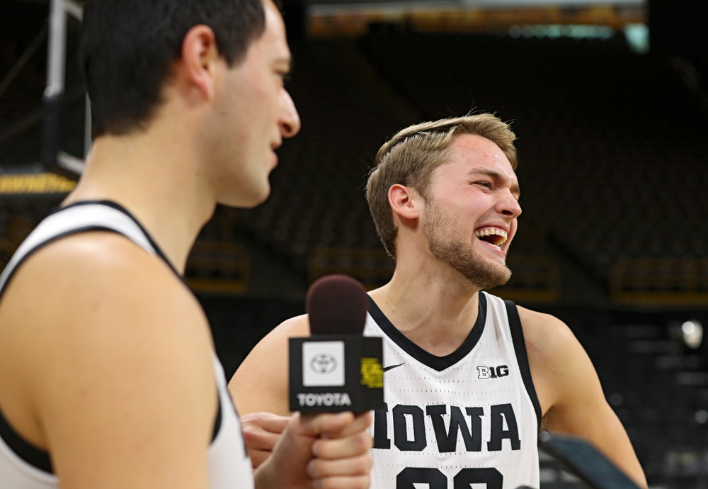 Iowa Hawkeyes forward Riley Till (20) laughs as forward Ryan Kriener (15) answers a question from him during Iowa Men’s Basketball Media Day at Carver-Hawkeye Arena in Iowa City on Wednesday, Oct 9, 2019. (Stephen Mally/hawkeyesports.com)