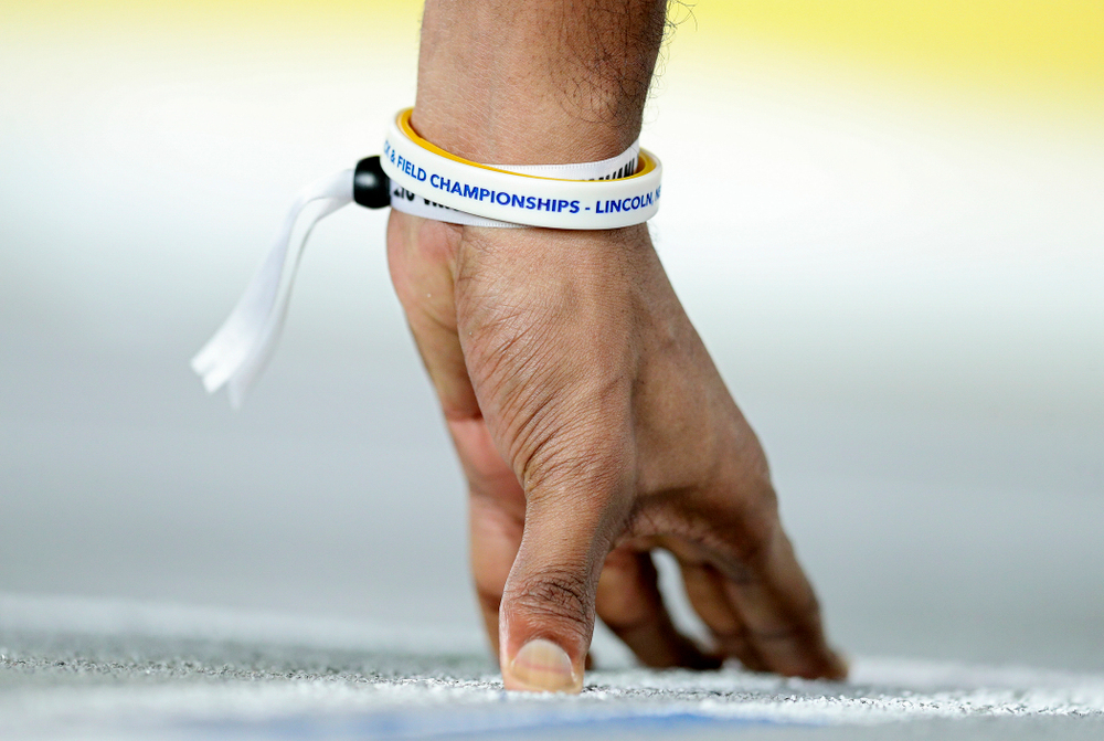 Iowa’s DeJuan Frye places his hand at the starting line for the men’s 400 meter dash premier event during the Larry Wieczorek Invitational at the Recreation Building in Iowa City on Saturday, January 18, 2020. (Stephen Mally/hawkeyesports.com)