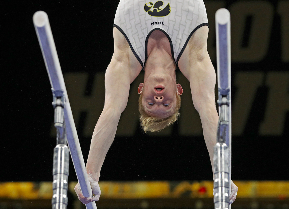 Iowa's Nick Merryman competes in the parallel bars during the second day of the Big Ten Men's Gymnastics Championships at Carver-Hawkeye Arena in Iowa City on Saturday, Apr. 6, 2019. (Stephen Mally/hawkeyesports.com)