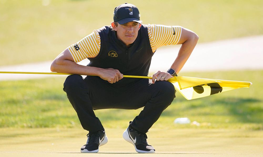 Iowa assistant coach Charlie Hoyle reads the green during the third round of the Hawkeye Invitational at Finkbine Golf Course in Iowa City on Sunday, Apr. 21, 2019. (Stephen Mally/hawkeyesports.com)