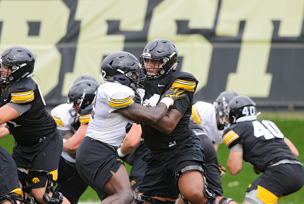 Iowa Hawkeyes offensive lineman Tristan Wirfs (74) blocks Iowa Hawkeyes linebacker Amani Jones (52)
during Fall Camp Practice No. 15 at the Hansen Football Performance Center in Iowa City on Monday, Aug 19, 2019. (Stephen Mally/hawkeyesports.com)