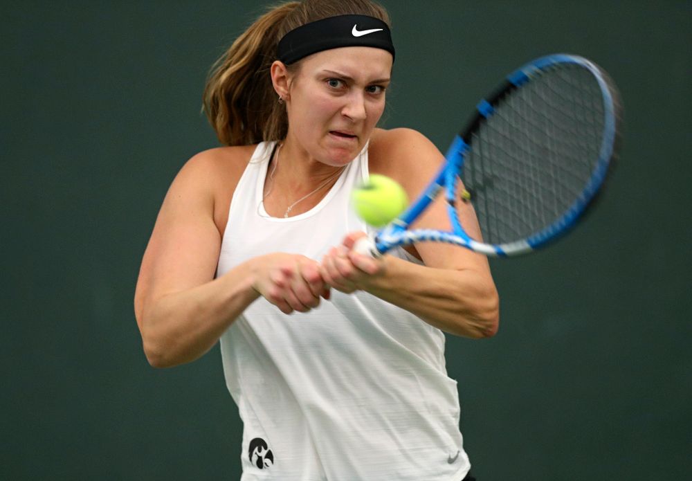 Iowa’s Ashleigh Jacobs returns a shot during her doubles match at the Hawkeye Tennis and Recreation Complex in Iowa City on Sunday, February 23, 2020. (Stephen Mally/hawkeyesports.com)