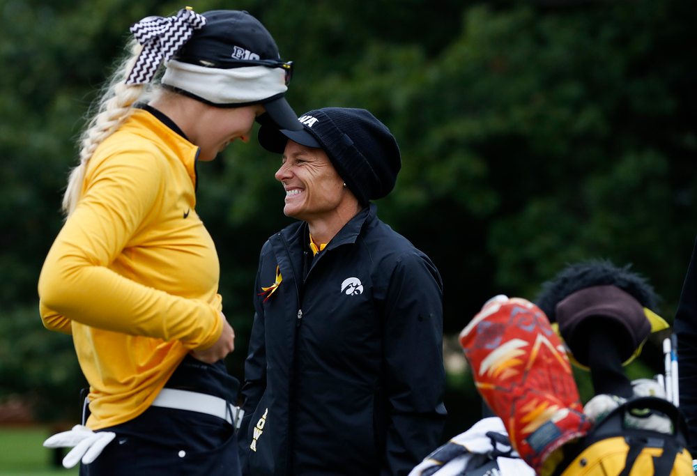 Iowa head coach Megan Menzel shares a laugh with Shawn Rennegarbe at the eighth tee during the Diane Thomason Invitational at Finkbine Golf Course on September 29, 2018. (Tork Mason/hawkeyesports.com)