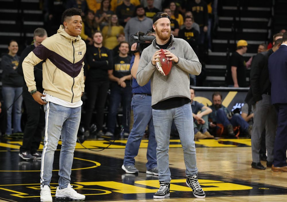 Former Hawkeye Football players and current San Francisco 49ers Greg Mabin, and CJ Beathard, against the Ohio State Buckeyes Saturday, January 12, 2019 at Carver-Hawkeye Arena. (Brian Ray/hawkeyesports.com)