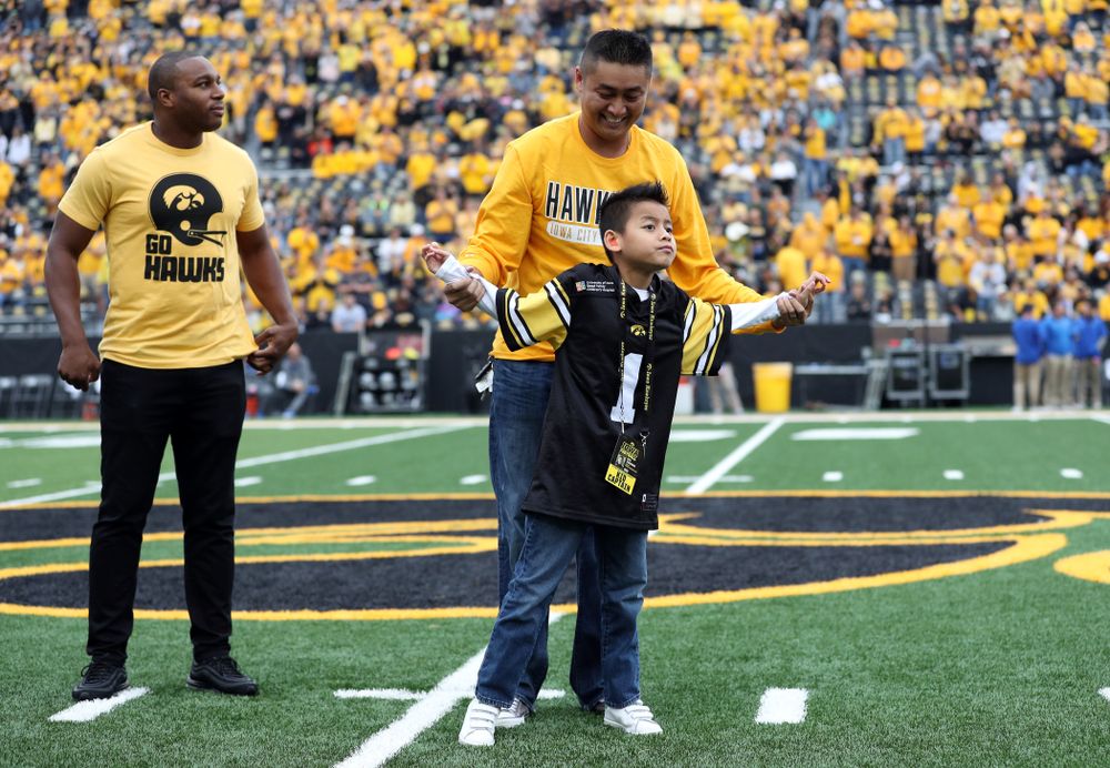 Stead Family ChildrenÕs Hospital Kid Captain Enzo Thongsoum and honorary captain Miguel Merrick before the Iowa Hawkeyes game against Middle Tennessee State Saturday, September 28, 2019 at Kinnick Stadium. (Max Allen/hawkeyesports.com)