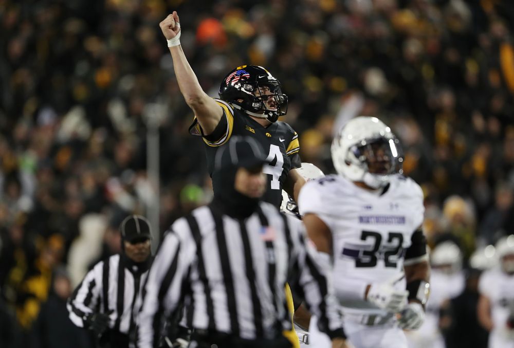 Iowa Hawkeyes quarterback Nate Stanley (4) celebrates a touchdown against the Northwestern Wildcats Saturday, November 10, 2018 at Kinnick Stadium. (Brian Ray/hawkeyesports.com)