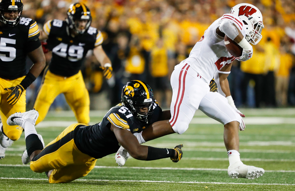 Iowa Hawkeyes defensive end Chauncey Golston (57) makes a tackle during a game against Wisconsin at Kinnick Stadium on September 22, 2018. (Tork Mason/hawkeyesports.com)