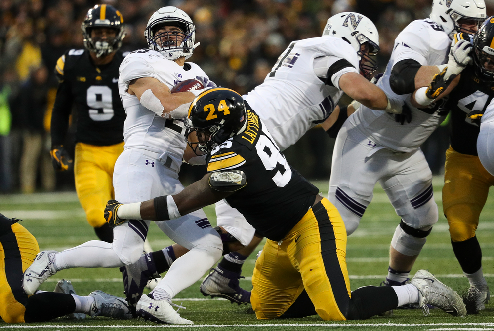 Iowa Hawkeyes defensive lineman Cedrick Lattimore (95) makes a tackle during a game against Northwestern at Kinnick Stadium on November 10, 2018. (Tork Mason/hawkeyesports.com)