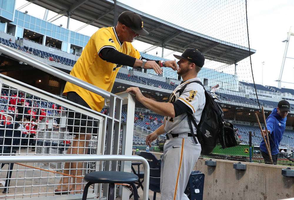 Iowa Hawkeyes Cole McDonald (11) hugs his father after getting the win against the Indiana Hoosiers in the first round of the Big Ten Baseball Tournament Wednesday, May 22, 2019 at TD Ameritrade Park in Omaha, Neb. (Brian Ray/hawkeyesports.com)