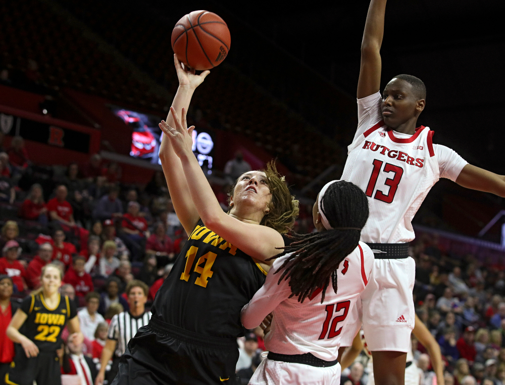 Iowa guard/forward McKenna Warnock (14) makes a basket while being fouled during the second quarter of their game at the Rutgers Athletic Center in Piscataway, N.J. on Sunday, March 1, 2020. (Stephen Mally/hawkeyesports.com)