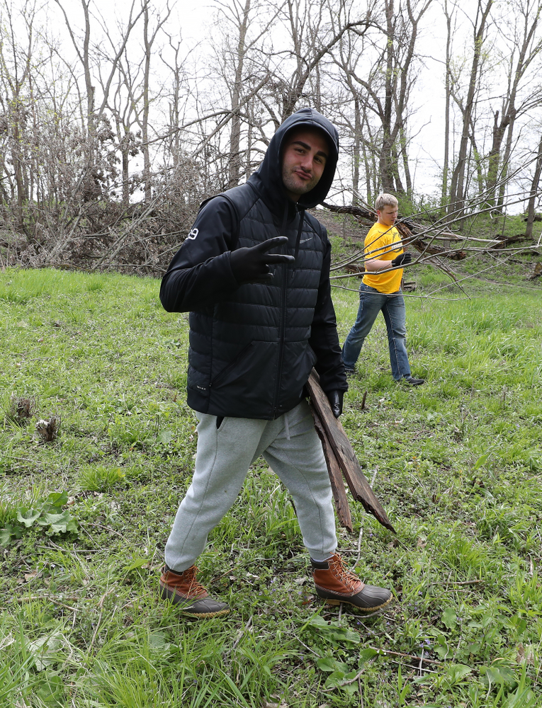 Members of the Hawkeye Football team volunteer with the Iowa City Public Works department along the Iowa River during the annual Iowa Athletics Day of Caring Sunday, April 28, 2019 in Iowa City. (Brian Ray/hawkeyesports.com)