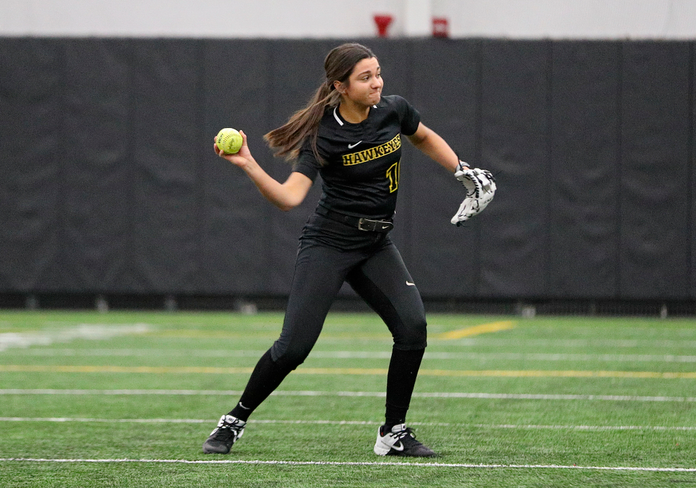 Iowa infielder Nicole Yoder (10) throws to first as they run a drill during Iowa Softball Media Day at the Hawkeye Tennis and Recreation Complex in Iowa City on Thursday, January 30, 2020. (Stephen Mally/hawkeyesports.com)