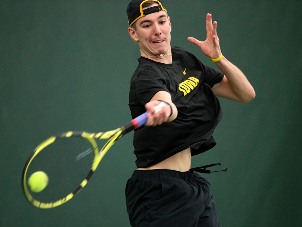 Iowa’s Nikita Snezhko returns a shot during his singles match at the Hawkeye Tennis and Recreation Complex in Iowa City on Friday, February 14, 2020. (Stephen Mally/hawkeyesports.com)