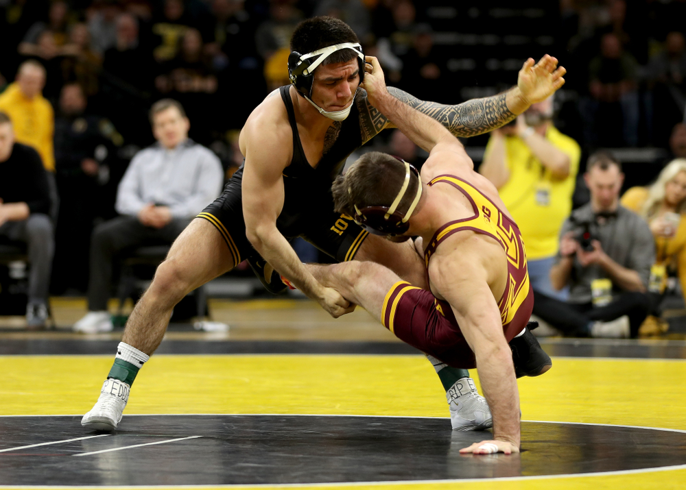 Iowa’s Pat Lugo wrestles Minnesota’s Brayton Lee at 149 pounds Saturday, February 15, 2020 at Carver-Hawkeye Arena. Lugo won the match 3-2. (Brian Ray/hawkeyesports.com)
