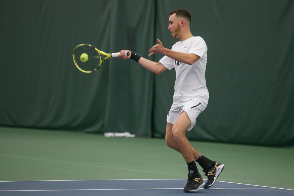 Iowa’s Kareem Allaf returns a hit during the Iowa men’s tennis meet vs Nebraska on Sunday, March 1, 2020 at the Hawkeye Tennis and Recreation Complex. (Lily Smith/hawkeyesports.com)