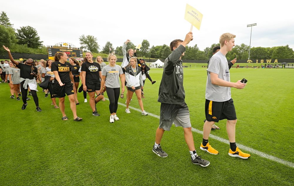 Student-athletes walk in the Parade of Champions during the Student-Athlete Kickoff at the Iowa Soccer Complex in Iowa City on Sunday, Aug 25, 2019. (Stephen Mally/hawkeyesports.com)