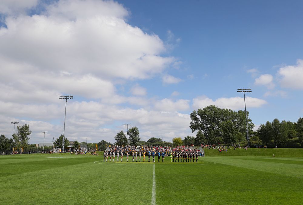 The Iowa Hawkeyes and Illinois State Redbirds stand for National Anthem before their match at the Iowa Soccer Complex in Iowa City on Sunday, Sep 1, 2019. (Stephen Mally/hawkeyesports.com)