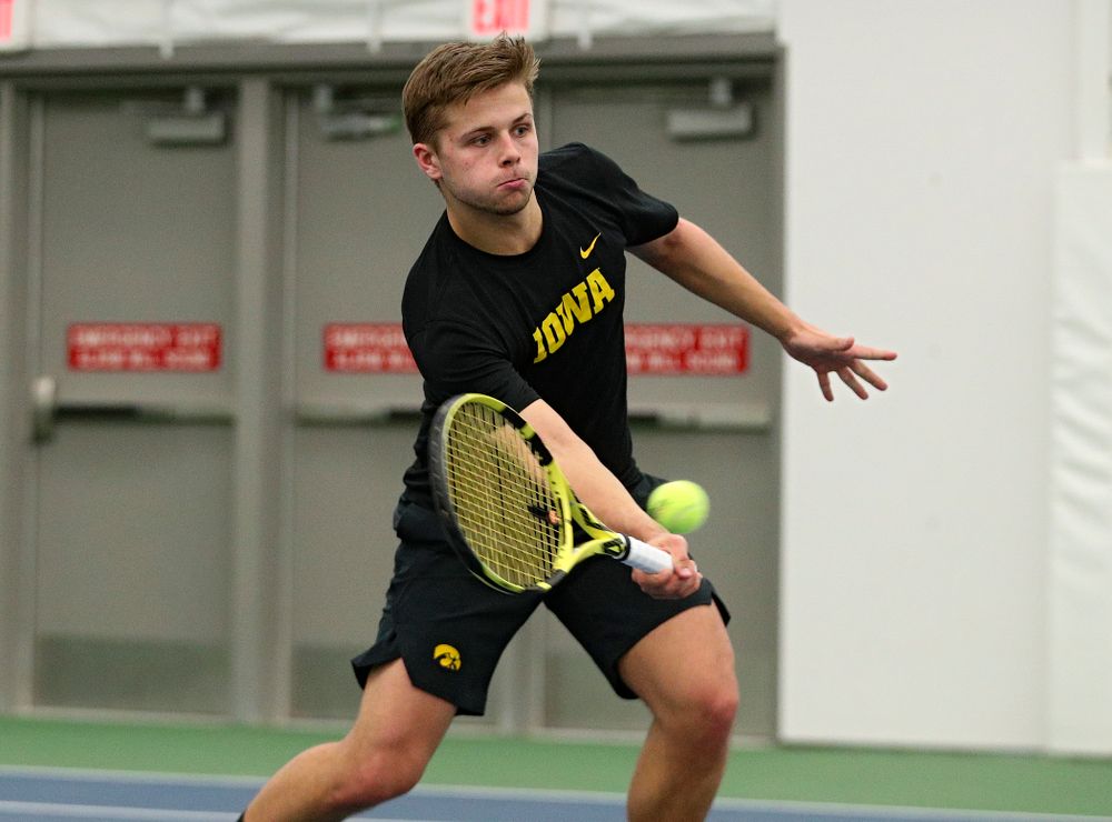 Iowa’s Will Davies returns a shot during his singles match at the Hawkeye Tennis and Recreation Complex in Iowa City on Friday, March 6, 2020. (Stephen Mally/hawkeyesports.com)