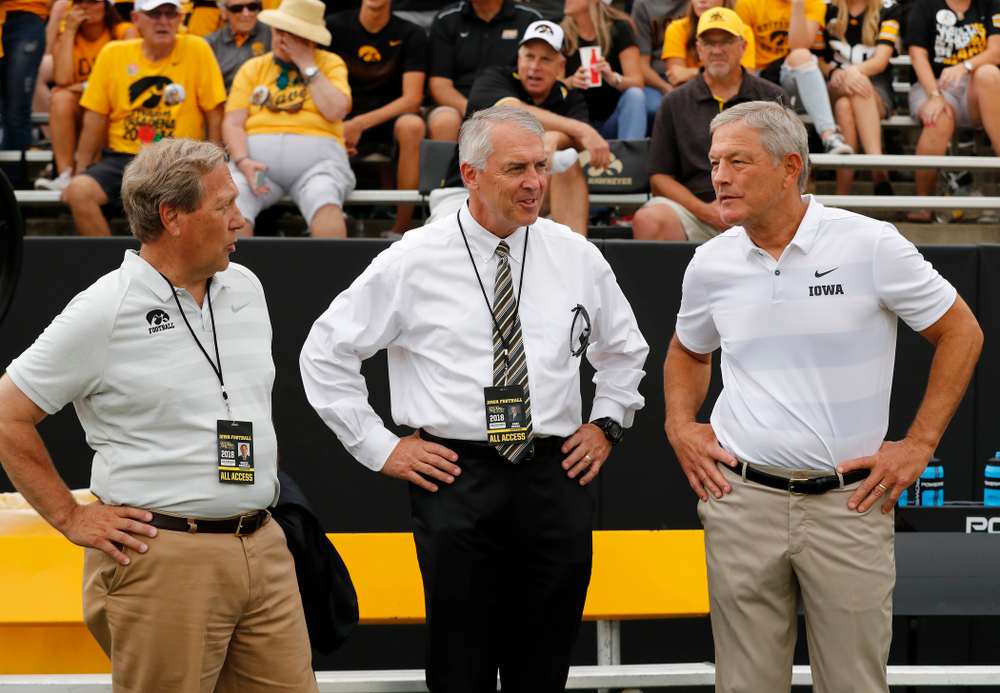 Iowa Hawkeyes head coach Kirk Ferentz talks with University of Iowa President Bruce Harreld and athletics director Gary Barta before their game against the Northern Illinois Huskies Saturday, September 1, 2018 at Kinnick Stadium. (Brian Ray/hawkeyesports.com)
