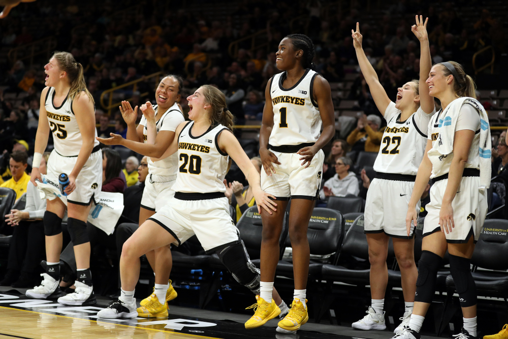 Iowa Hawkeyes guard Kate Martin (20) and guard Tomi Taiwo (1) celebrate a three point basket by guard Megan Meyer (11) against Florida Atlantic University Thursday, November 7, 2019 at Carver-Hawkeye Arena. (Brian Ray/hawkeyesports.com)