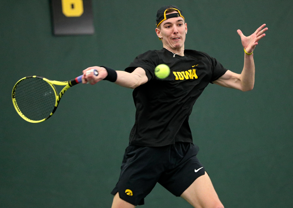 Iowa’s Nikita Snezhko returns a shot during his singles match at the Hawkeye Tennis and Recreation Complex in Iowa City on Friday, February 14, 2020. (Stephen Mally/hawkeyesports.com)