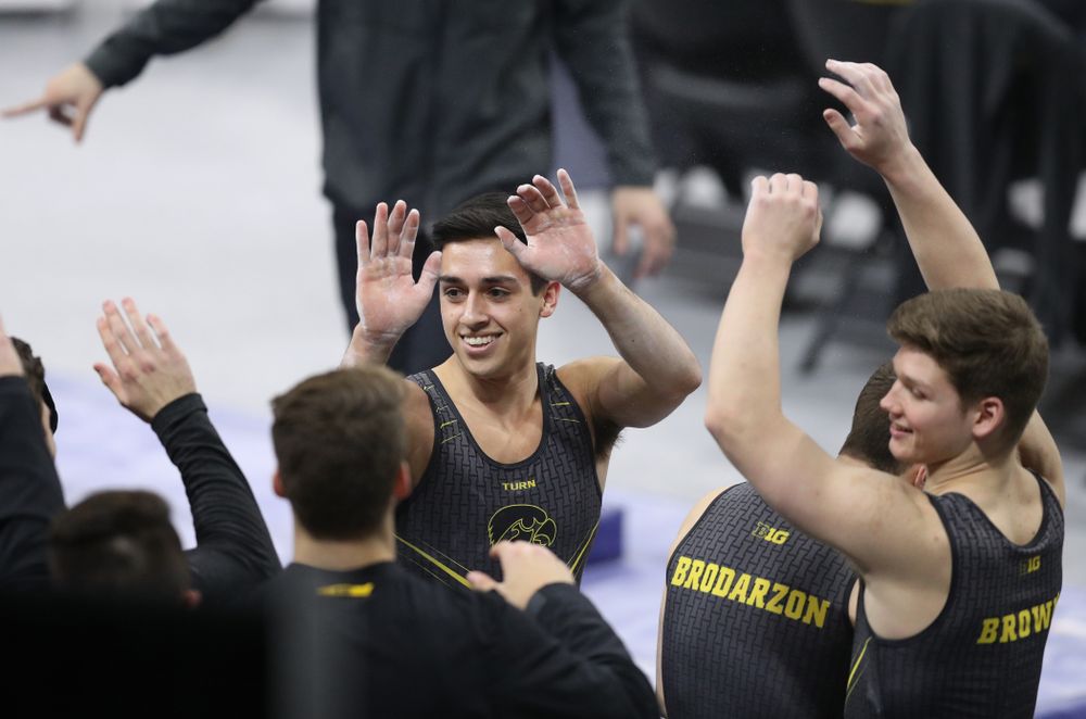 Iowa's Andrew Herrador competes on the parallel bars against Oklahoma Saturday, February 9, 2019 at Carver-Hawkeye Arena. (Brian Ray/hawkeyesports.com)