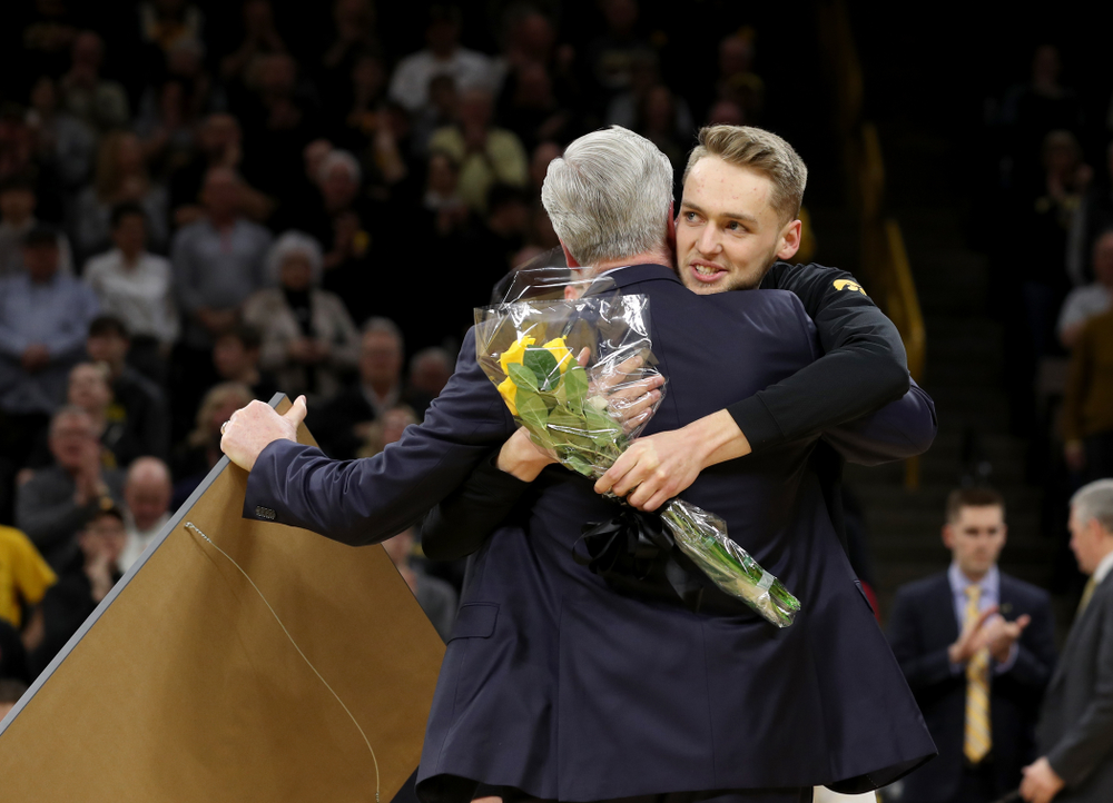 Iowa Hawkeyes forward Riley Till (20) hugs head coach Fran McCaffery during senior night festivities before their game against the Purdue Boilermakers Tuesday, March 3, 2020 at Carver-Hawkeye Arena. (Brian Ray/hawkeyesports.com)