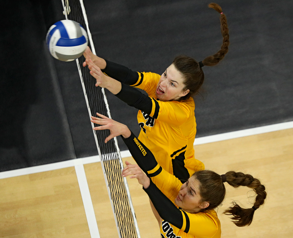 Iowa’s Courtney Buzzerio (2) and Blythe Rients (11) try to block a shot during the fourth set of their match at Carver-Hawkeye Arena in Iowa City on Friday, Nov 29, 2019. (Stephen Mally/hawkeyesports.com)