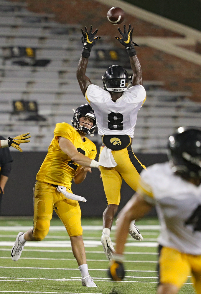 Iowa Hawkeyes quarterback Peyton Mansell (2) throws a pass just over the hands of defensive back Matt Hankins (8) during Fall Camp Practice No. 12 at Kinnick Stadium in Iowa City on Thursday, Aug 15, 2019. (Stephen Mally/hawkeyesports.com)