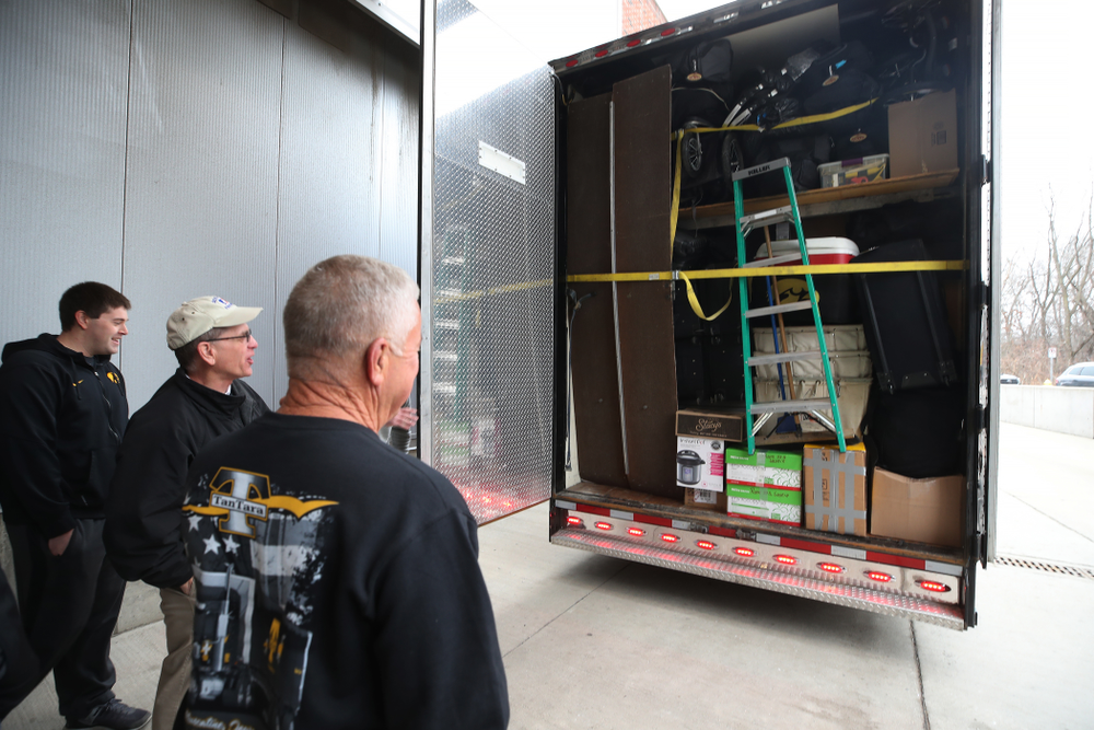 TanTara Transportation Corporation President Mike Riggan and head football equipment manager Greg Morris prepare to lock up the trailer before departing for Tampa, Florida Friday, December 21, 2018 at the Hansen Football Performance Center. (Brian Ray/hawkeyesports.com)