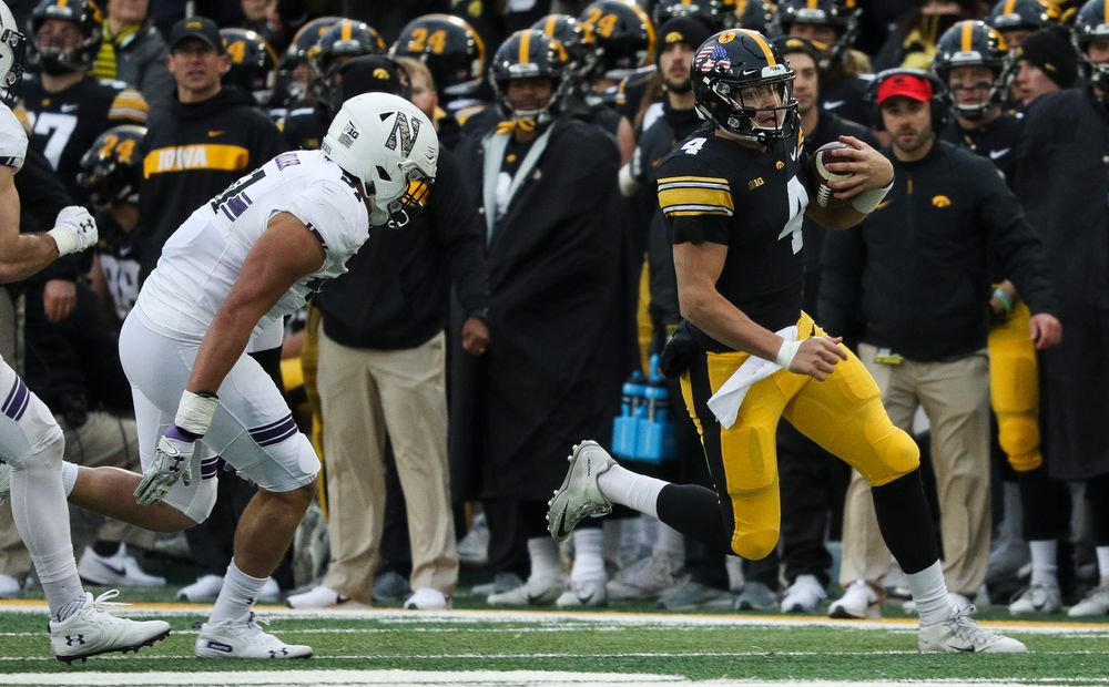 Iowa Hawkeyes quarterback Nate Stanley (4) runs the ball during a game against Northwestern at Kinnick Stadium on November 10, 2018. (Tork Mason/hawkeyesports.com)