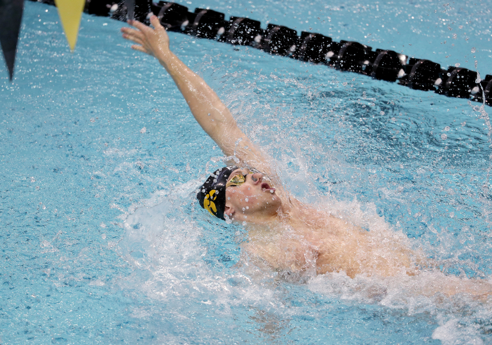 IowaÕs John Colin competes in the 100 yard backstroke against Notre Dame and Illinois Saturday, January 11, 2020 at the Campus Recreation and Wellness Center. (Brian Ray/hawkeyesports.com)
