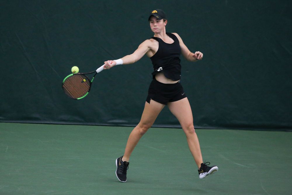 Iowa’s Elise van Heuvelen returns a hit during the Iowa women’s tennis meet vs DePaul on Friday, February 21, 2020 at the Hawkeye Tennis and Recreation Complex. (Lily Smith/hawkeyesports.com)