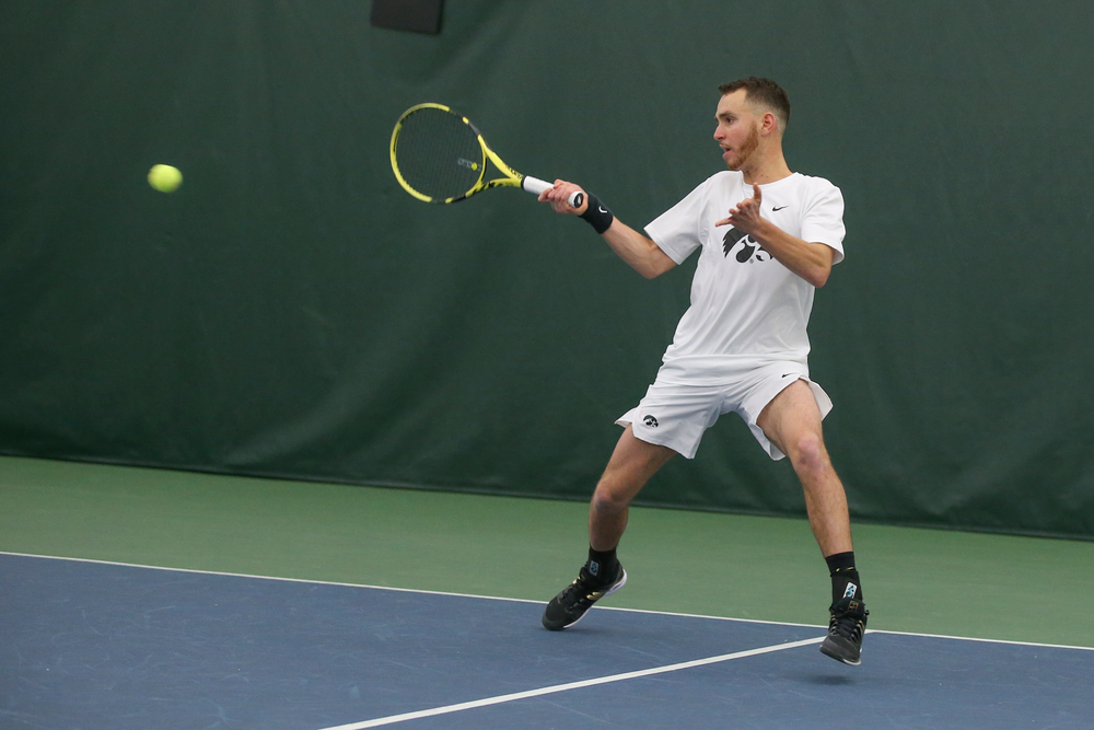 Iowa’s Kareem Allaf returns a hit during the Iowa men’s tennis meet vs Nebraska on Sunday, March 1, 2020 at the Hawkeye Tennis and Recreation Complex. (Lily Smith/hawkeyesports.com)